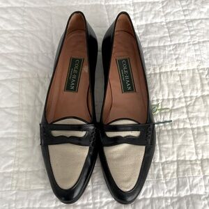 Pair of black leather Italian flats with cream linen insert.